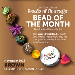 November 2022 Bead of the Month: The Sweet Swirl Bead reminds us that, no matter how grey the day, you can always find a little bit of sunshine. 